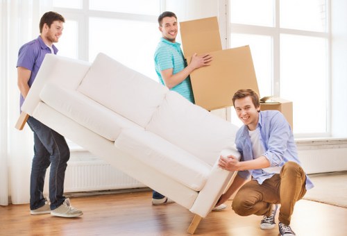 Removal team loading household furniture for transport in the Welling area