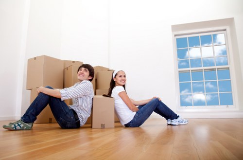 Room-by-room labeled packing boxes prepared for relocation in Welling