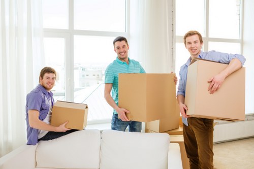 Trained removals staff handling furniture with care