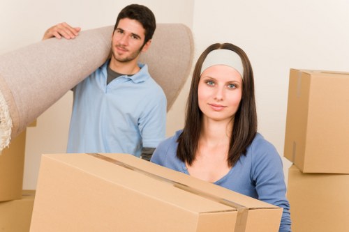 Packing and loading belongings into a moving truck in Welling