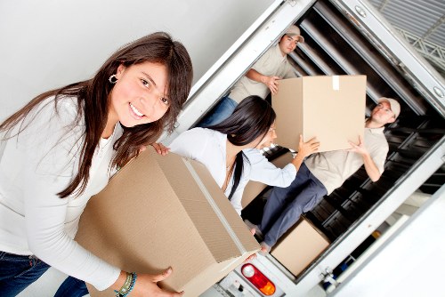 Packed boxes and furniture prepared for removal services in Welling